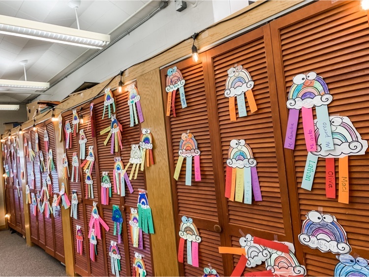 Students’ rainbows cover the back of the Spanish room. 